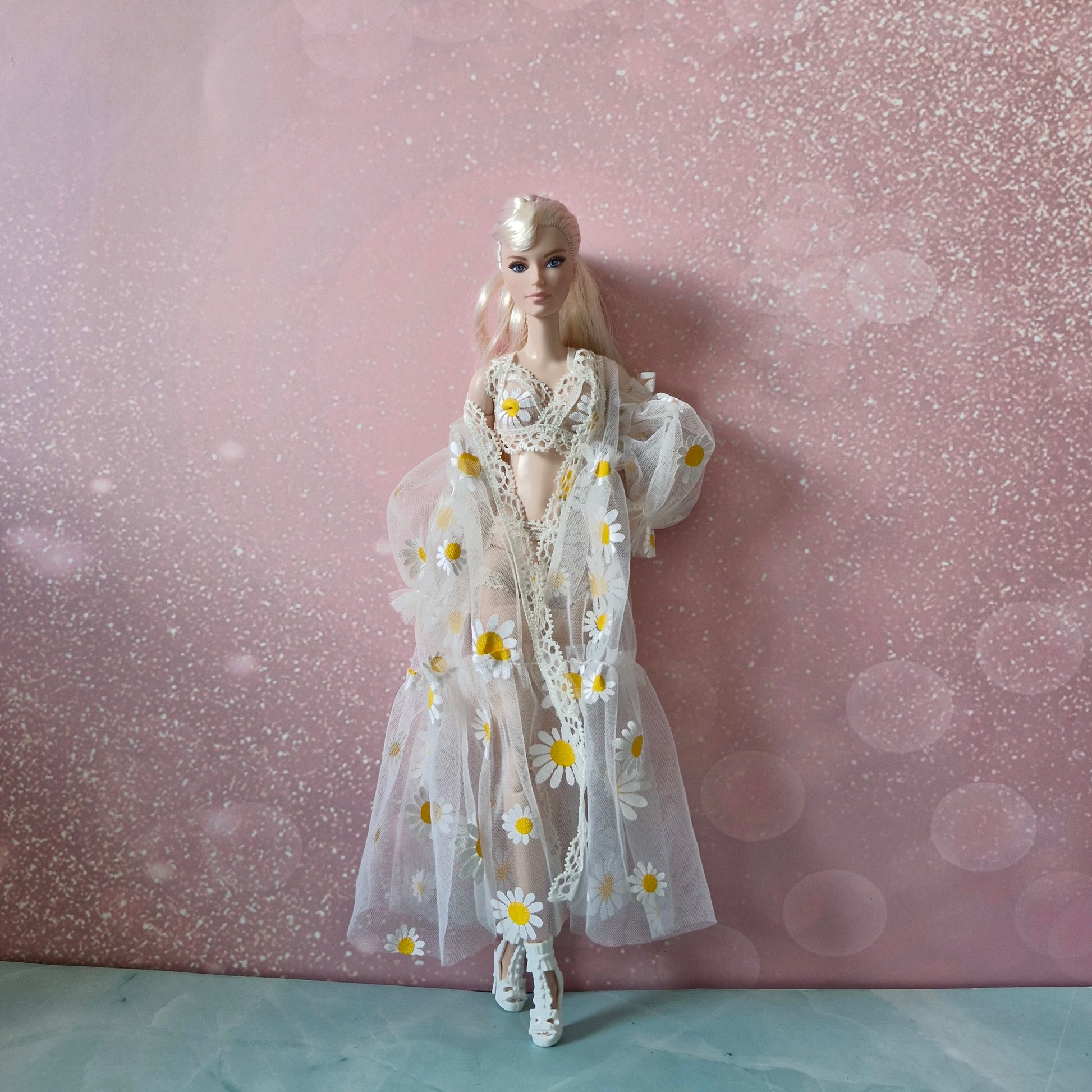 Platinum blonde Barbie doll modeling sweet daisy print sheer robe from 3-style lingerie collection.