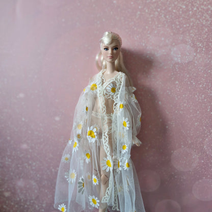 Close-up of platinum blonde Barbie in sheer daisy print robe, from the 3-piece doll lingerie set.