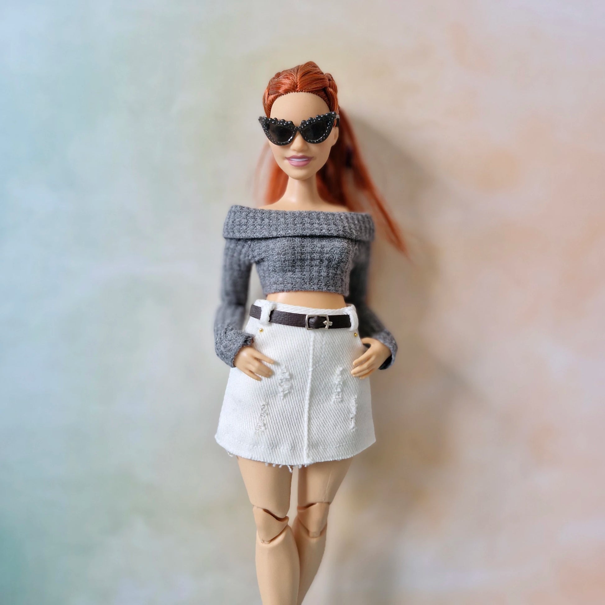 Barbie curvy doll in gray off-shoulder top and white mini skirt with sunglasses