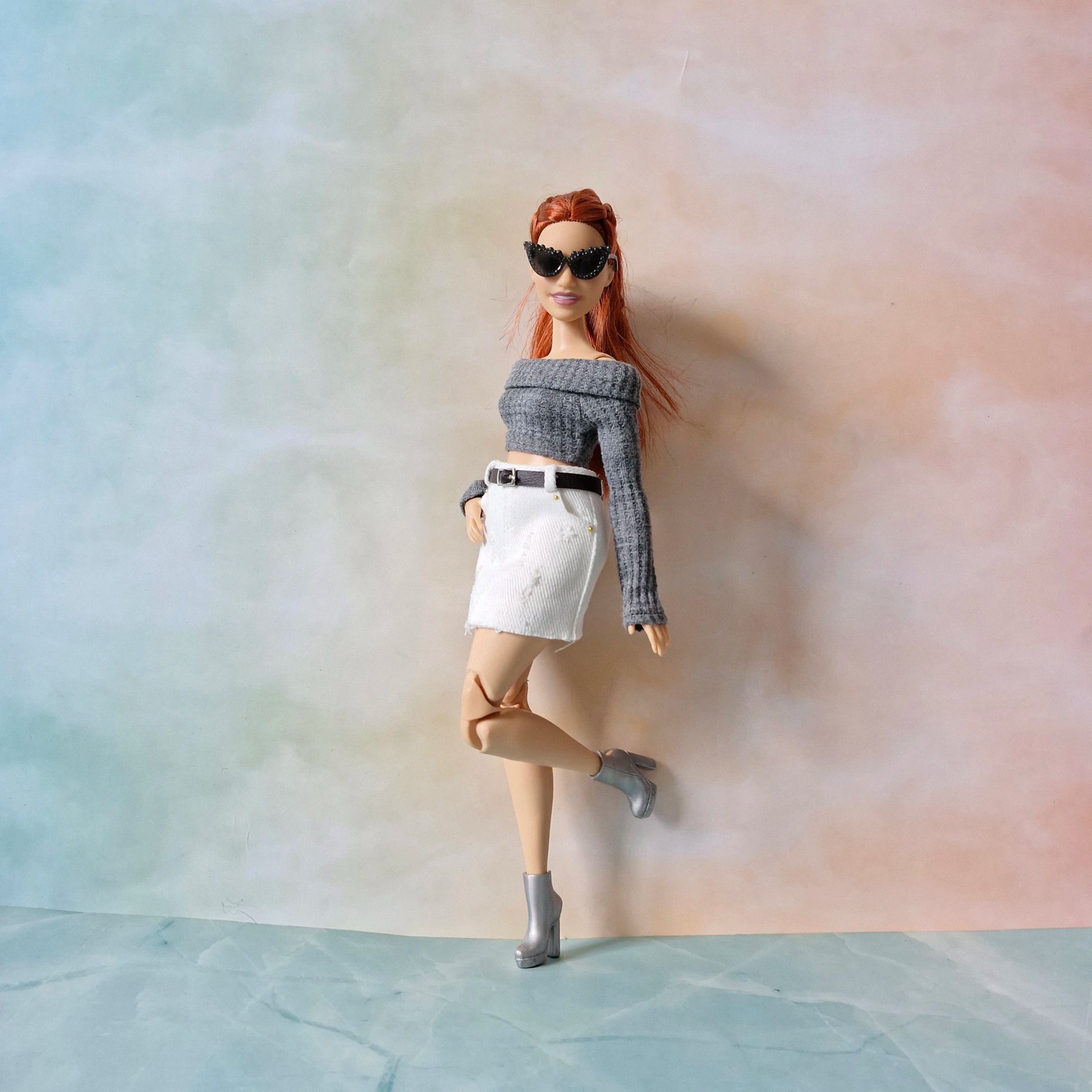 Curvy Barbie doll side pose in white skirt and off-shoulder top