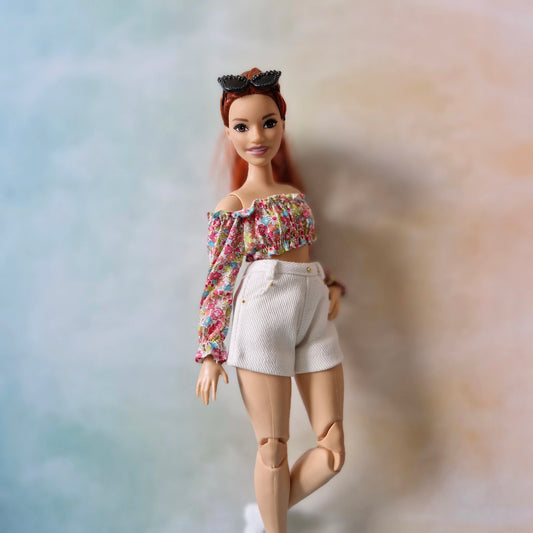 Close-up of a stylish long-sleeve floral crop top outfit for Curvy Barbie.
