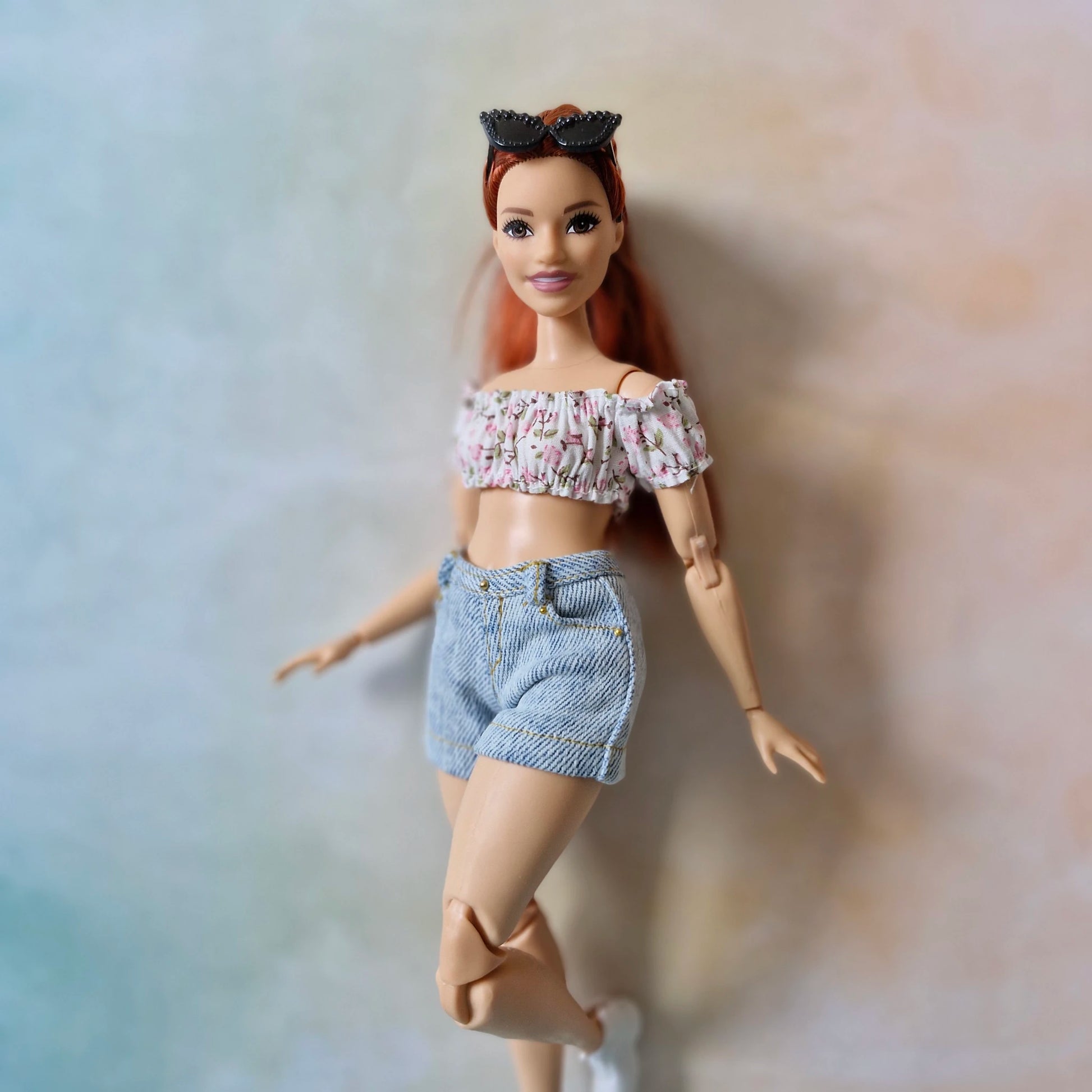 Curvy Barbie doll poses in a cute summer outfit for sale.
