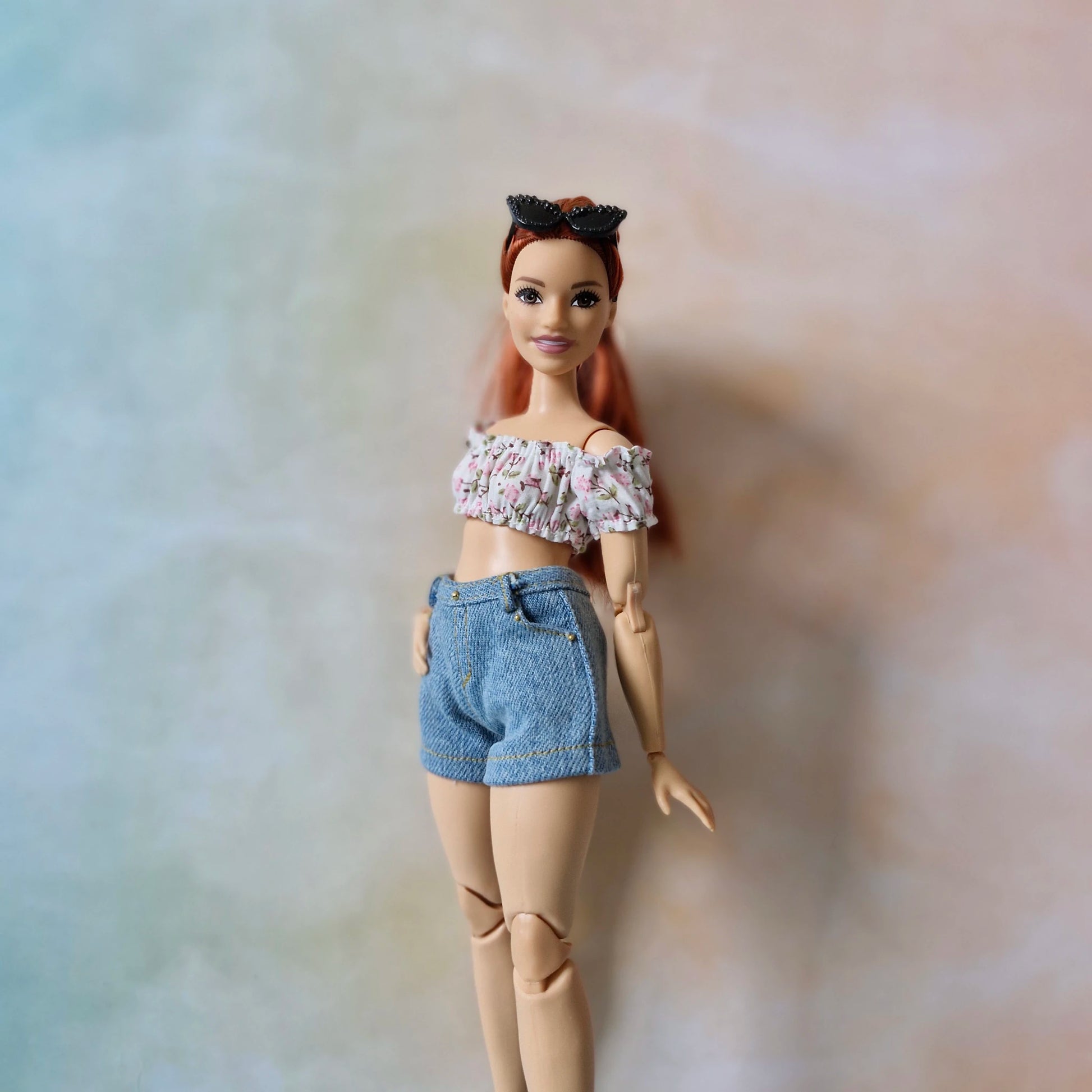 Handmade pink floral crop top and denim shorts for Curvy Barbie fashion.