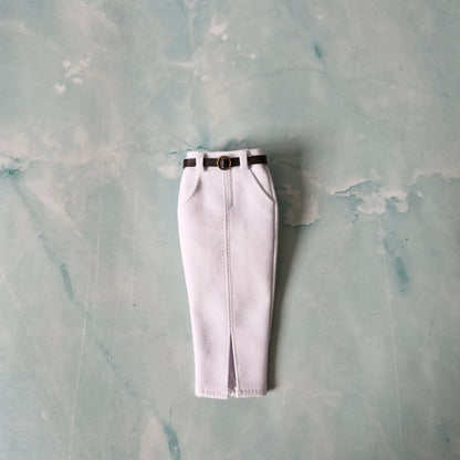 White pants with a black belt on a textured gray background