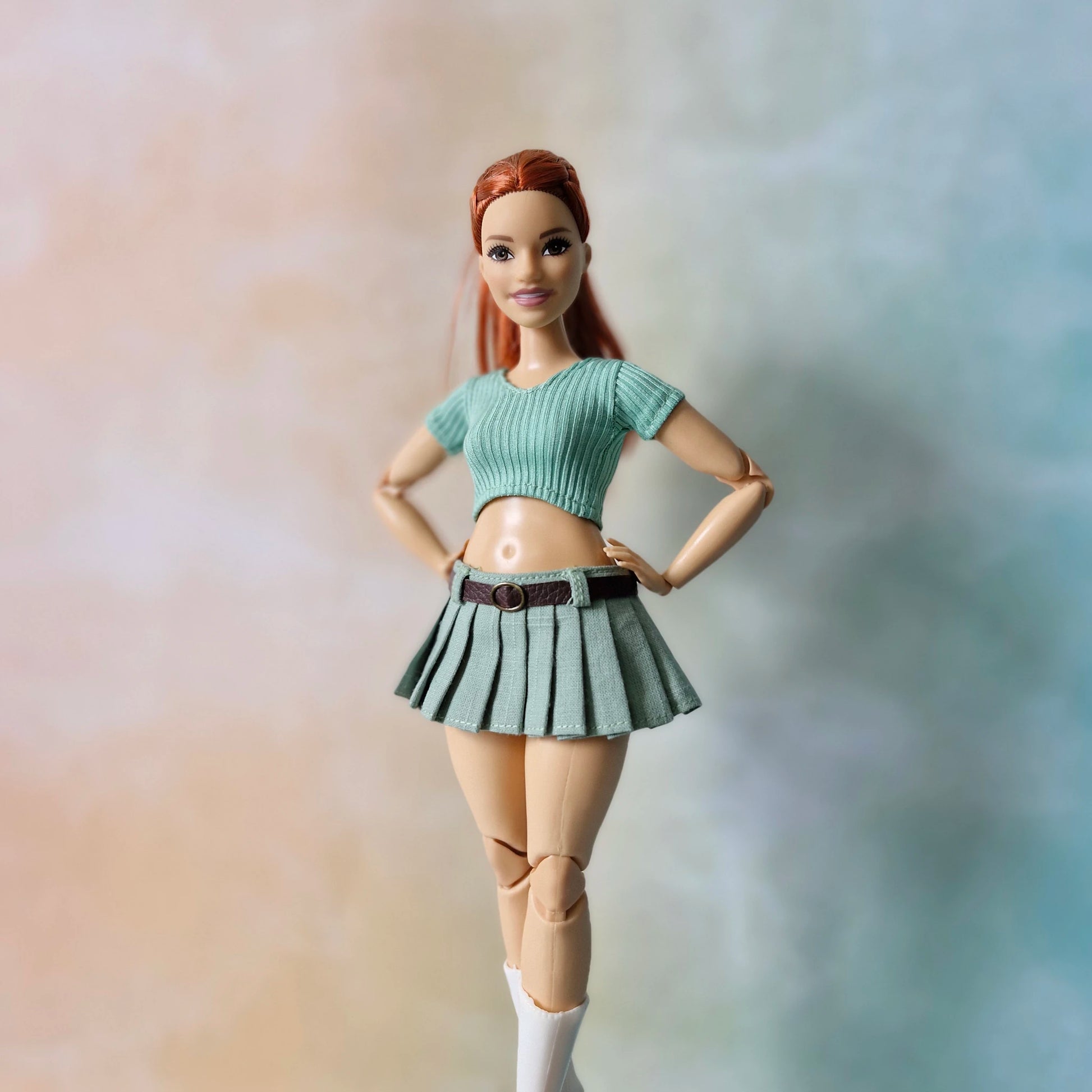 Barbie doll in a green outfit with a blurred background