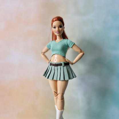 Barbie doll in a green outfit with a blurred background