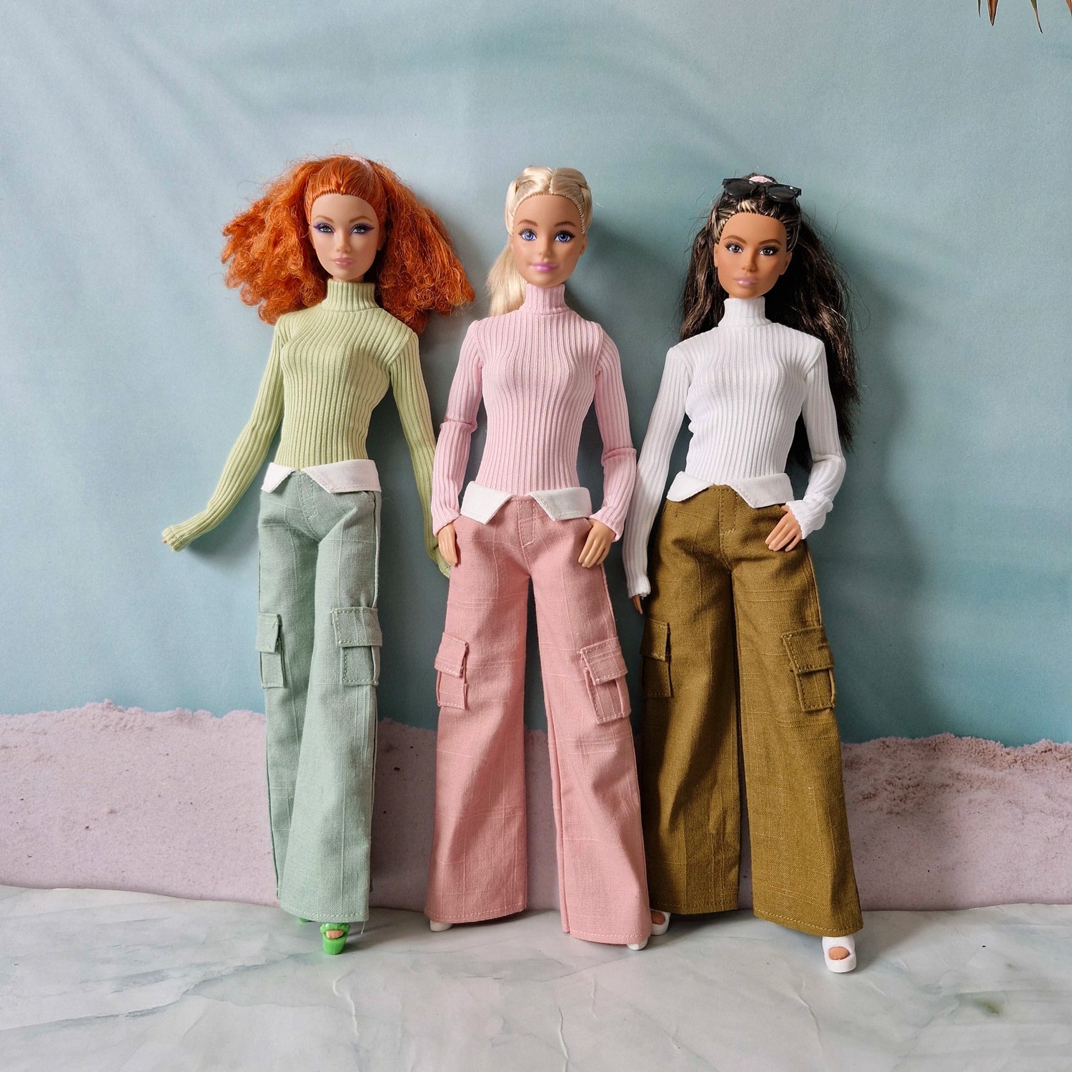 Group of 3 dolls modeling mix and match turtlenecks and wide leg pants separates