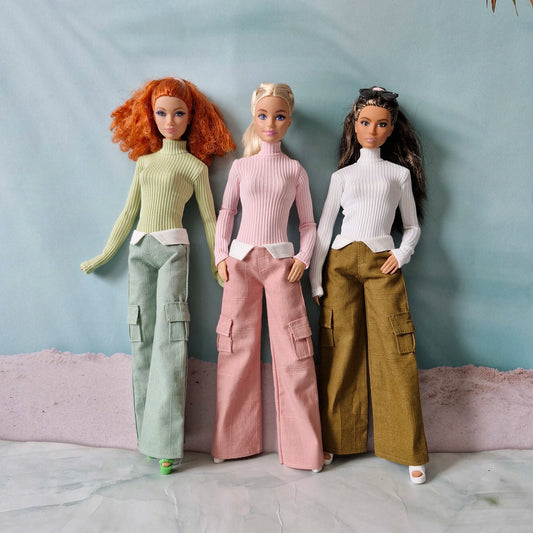 Group of 3 dolls modeling mix and match turtlenecks and wide leg pants separates
