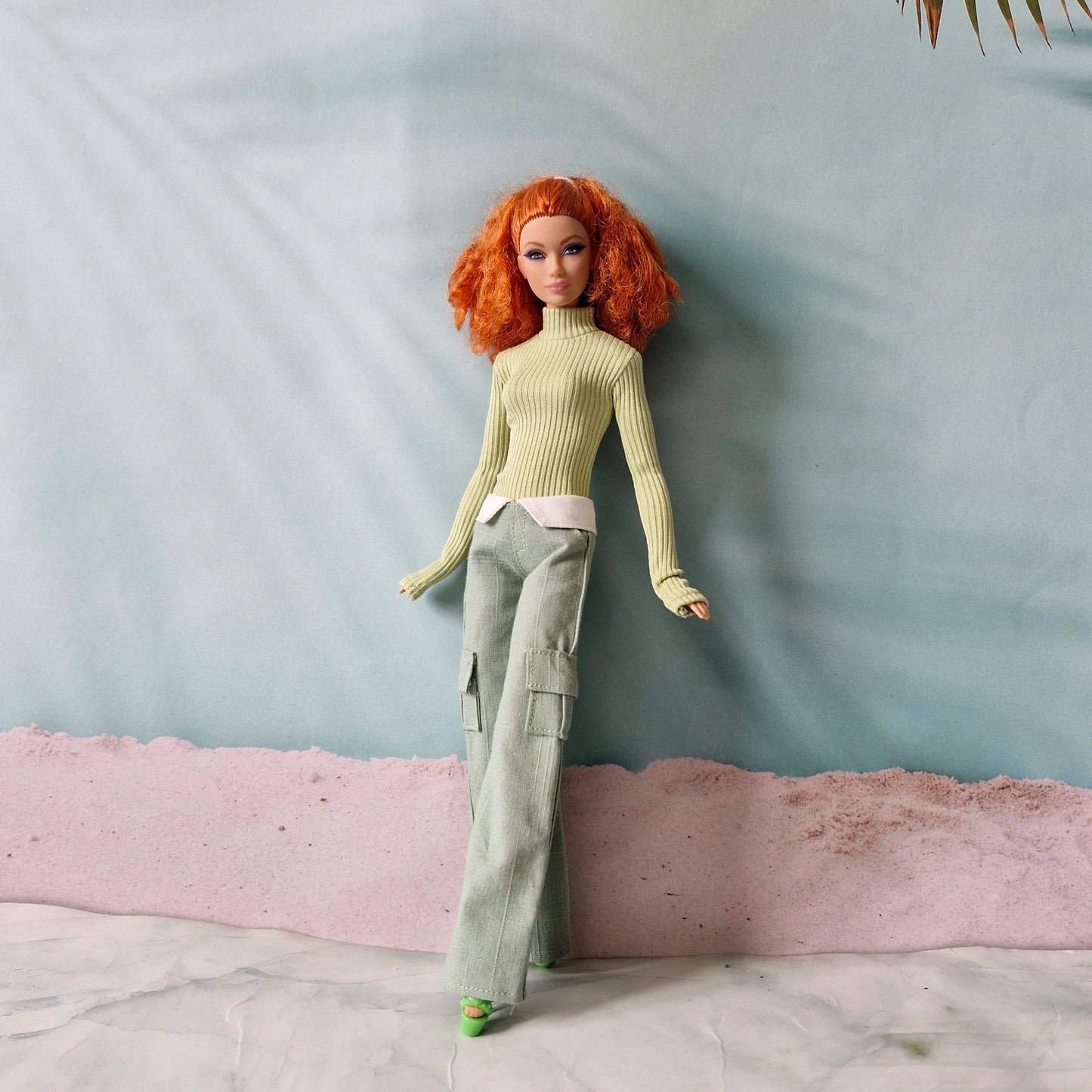 Redhead Barbie doll wearing sage green turtleneck and matching green cargo pants