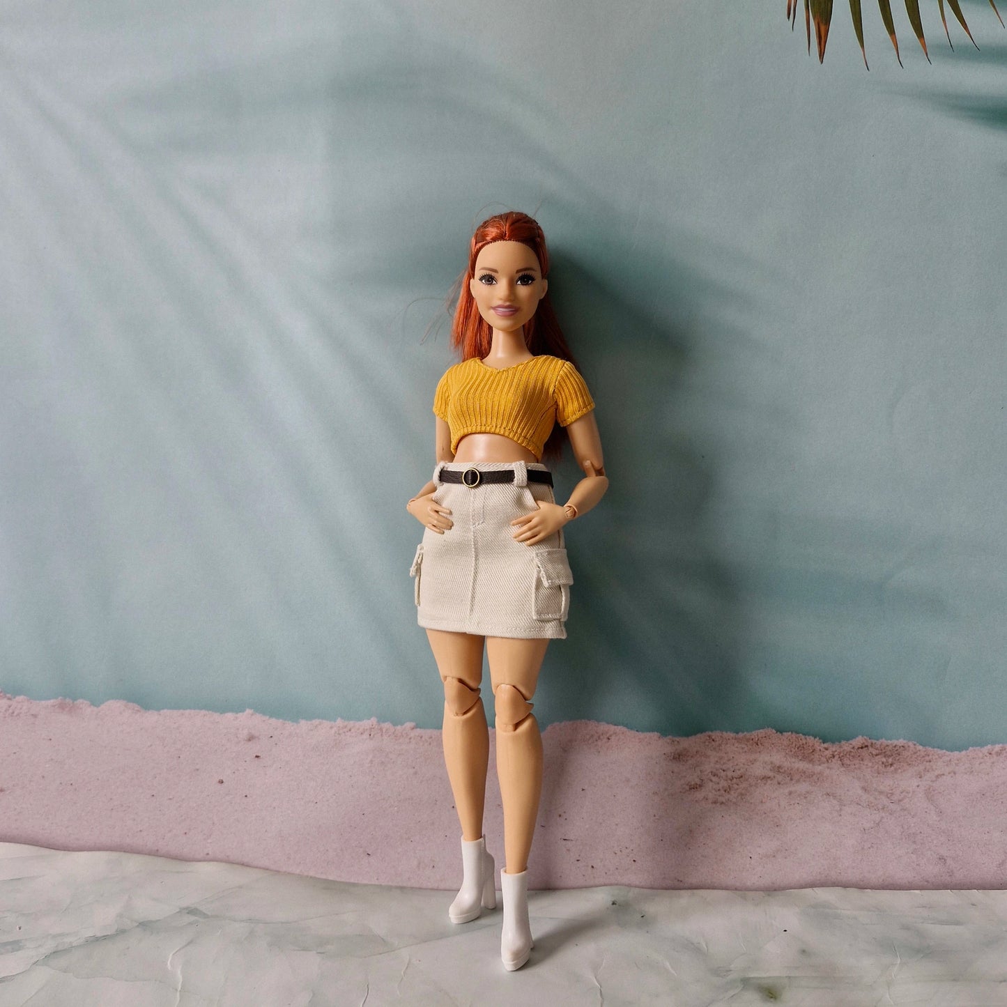 Curvy doll fashion separates styling with yellow ribbed shirt and white mini skirt