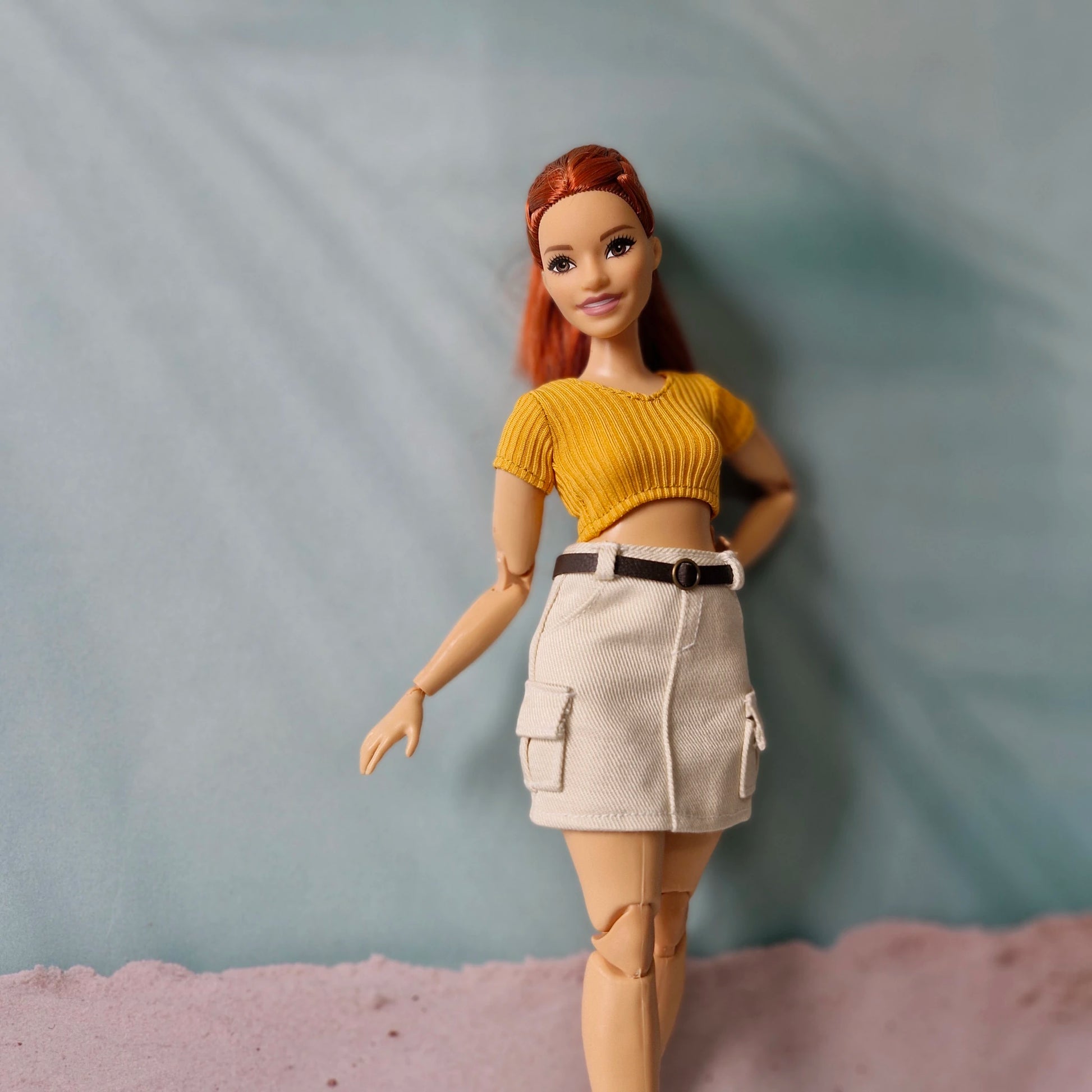 Curvy doll with red hair wearing trendy mix and match separates outfit