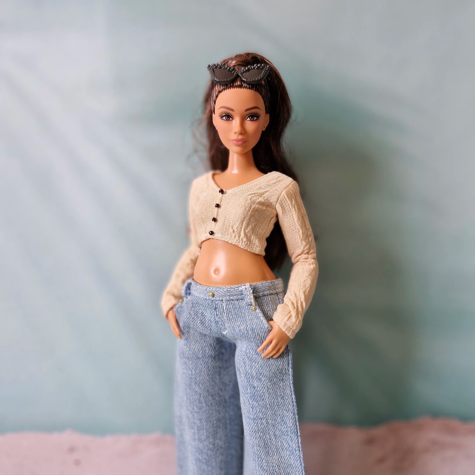 Close up of realistic doll clothes light blue denim jeans on Curvy body