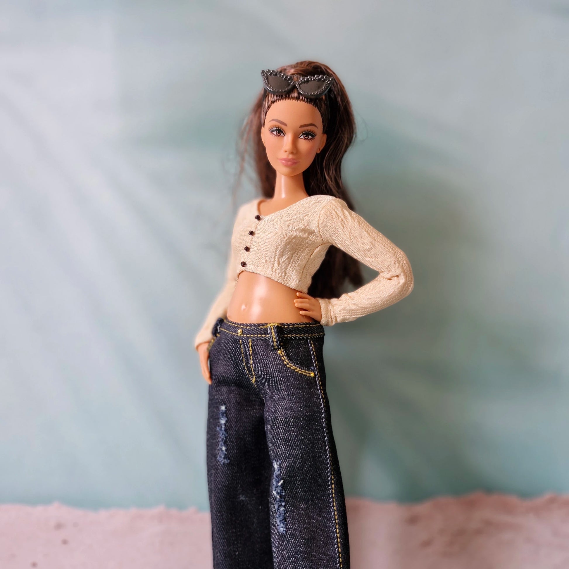 Side view of Curvy fashion doll wearing trendy dark denim wide leg pants