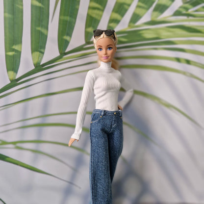 Barbie fashion doll modeling casual streetwear separates with dark blue jeans and white turtleneck