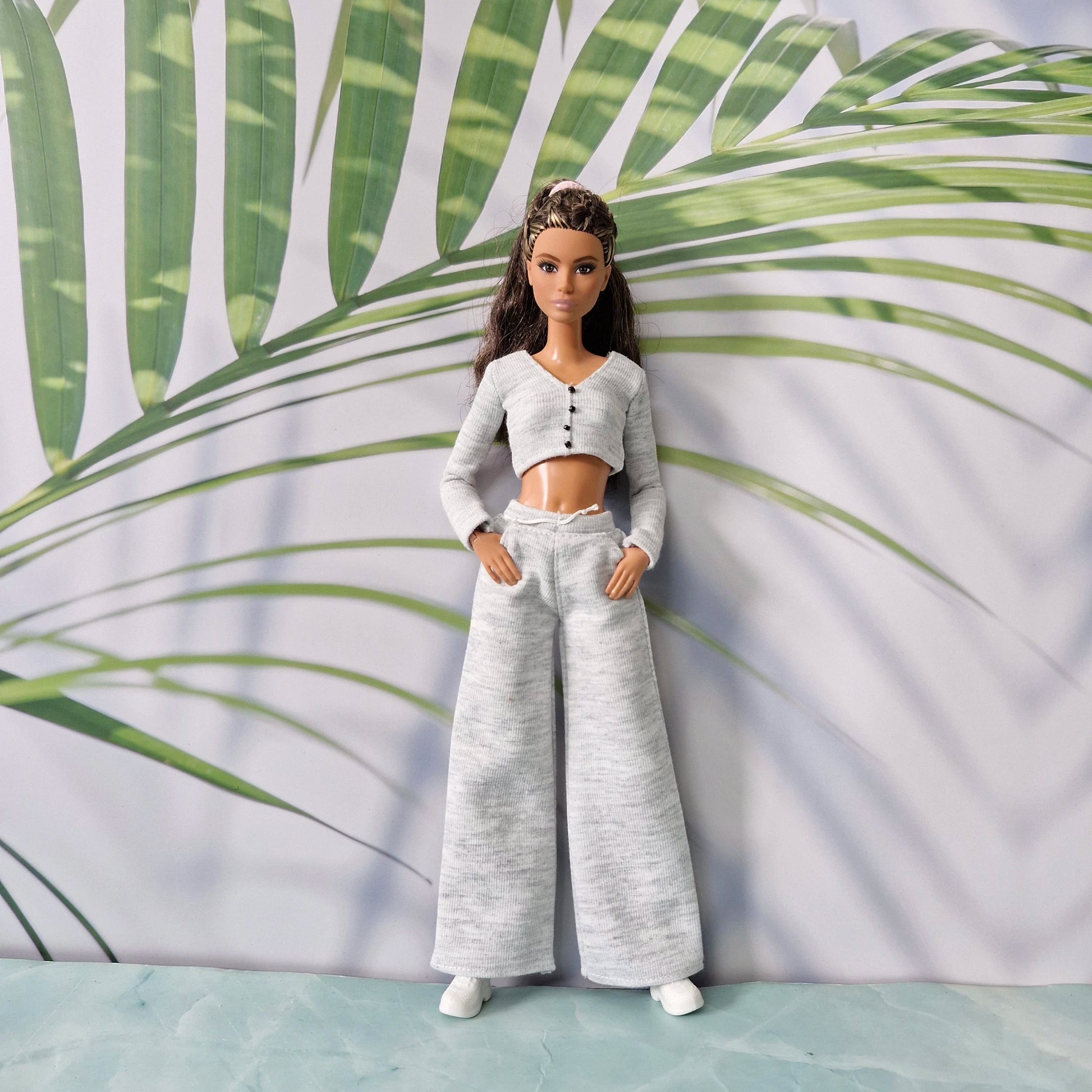 Barbie doll wearing grey long sleeve cropped cardigan and wide leg pants