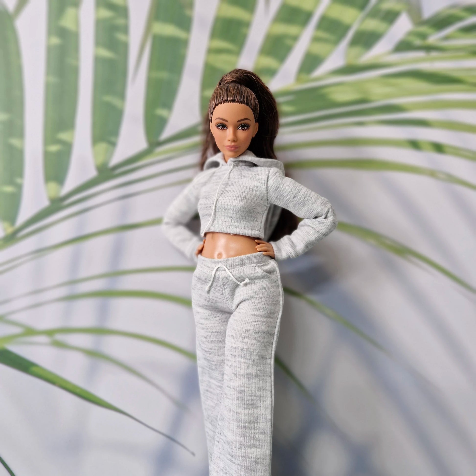 Barbie doll wearing grey cropped hoodie and wide leg sweatpants outfit