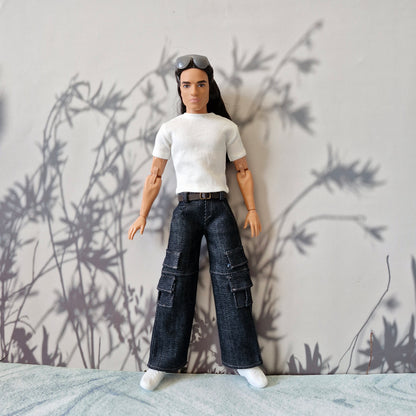 Full body shot of a Ken doll dressed in casual streetwear white shirt and dark denim