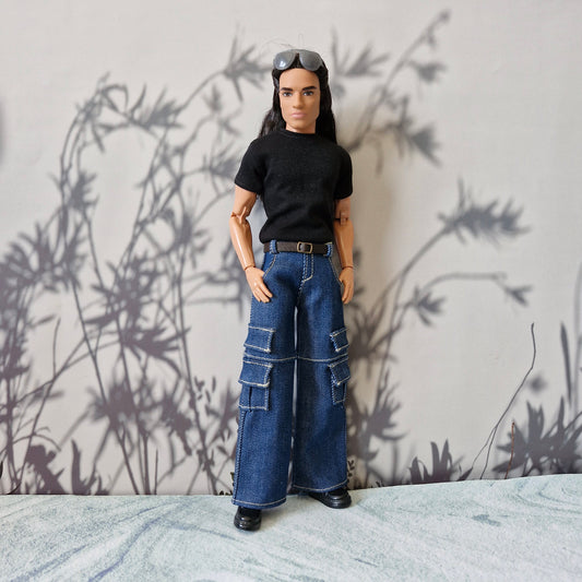 Full length view of a Ken doll in a black t-shirt and classic blue denim cargo pants