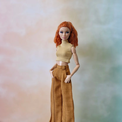 Redhead Barbie doll wearing a tan ribbed sleeveless turtleneck and brown wide-leg pants