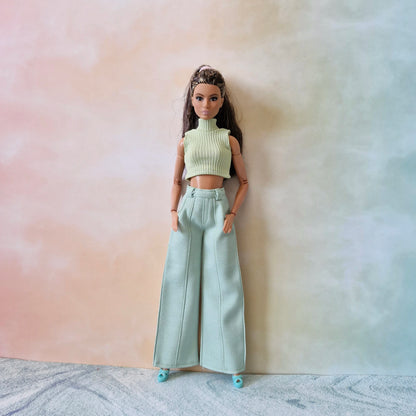 Brunette Barbie doll wearing a mint green sleeveless ribbed top and matching wide-leg pants