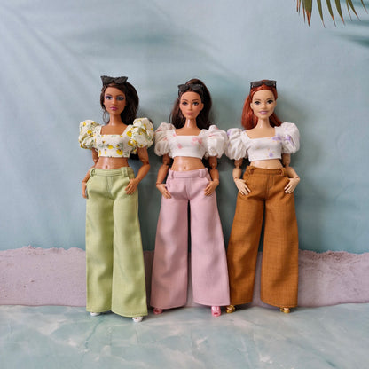 Trendy summer wardrobe for Curvy Barbie showing three distinct outfits with puff sleeve tops and colorful wide leg pants.