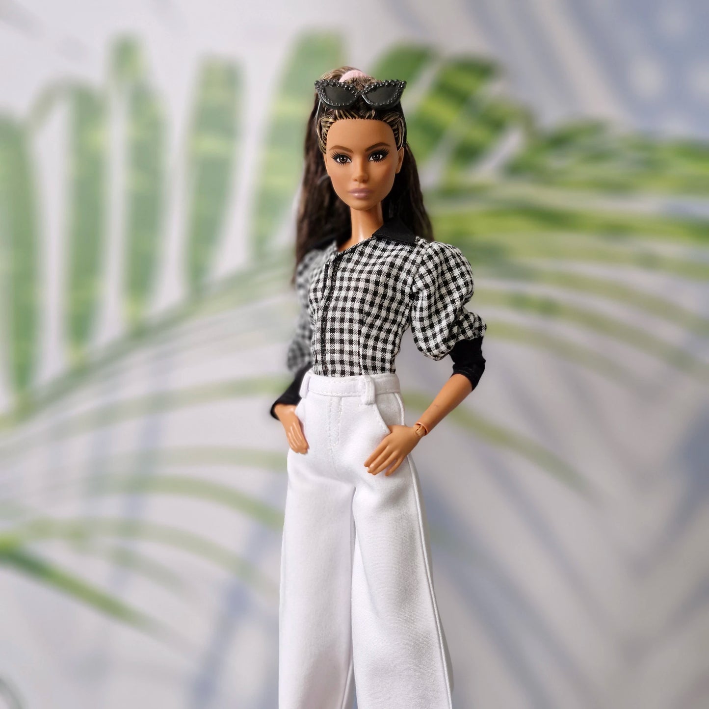 Trendy clothes for Barbie featuring a black and white gingham shirt and tailored white wide-leg pants.