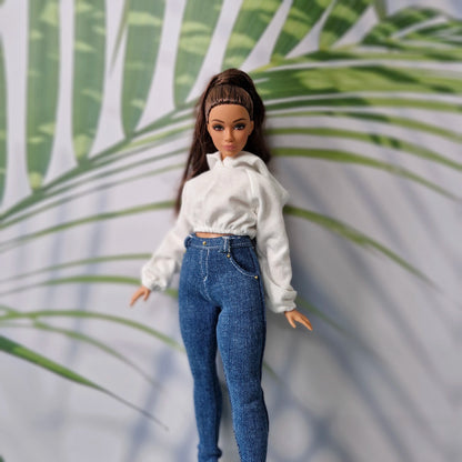 Beautiful curvy doll wearing handmade casual clothes featuring a white top and dark jeans for Curvy Barbie.