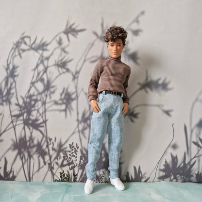 Doll dressed in a stylish brown ribbed sweater and light blue denim jeans for Ken.