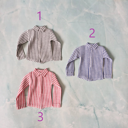 Flat lay of 3 handmade 1/6 scale striped long-sleeve shirts for Ken dolls, numbered 1 to 3.