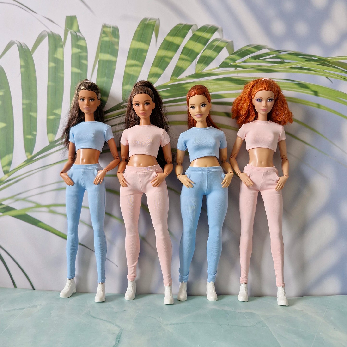Group of four 11.5 inch fashion dolls wearing casual ribbed separates in pink and blue for Barbie and for Curvy.