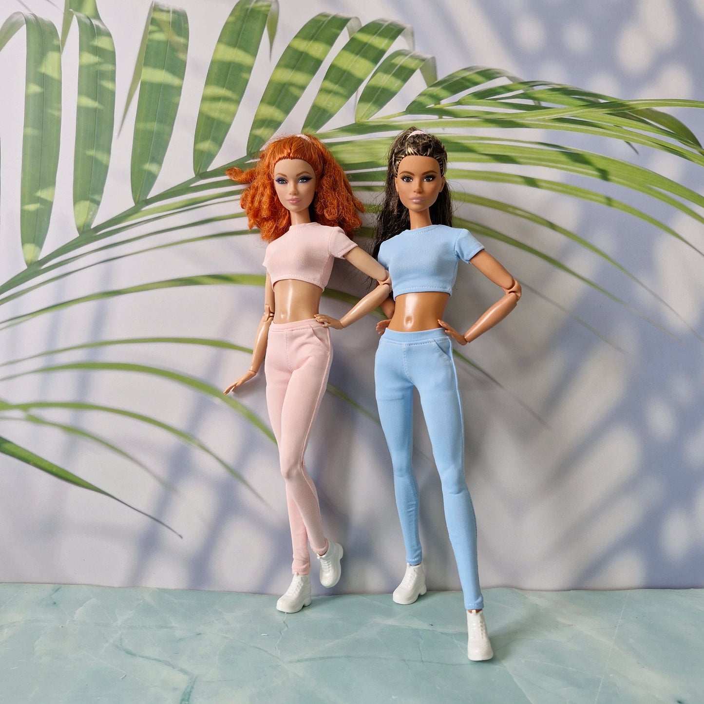 Standard doll in pink and Curvy doll in blue wearing mix and match ribbed separates for Barbie and for Curvy.
