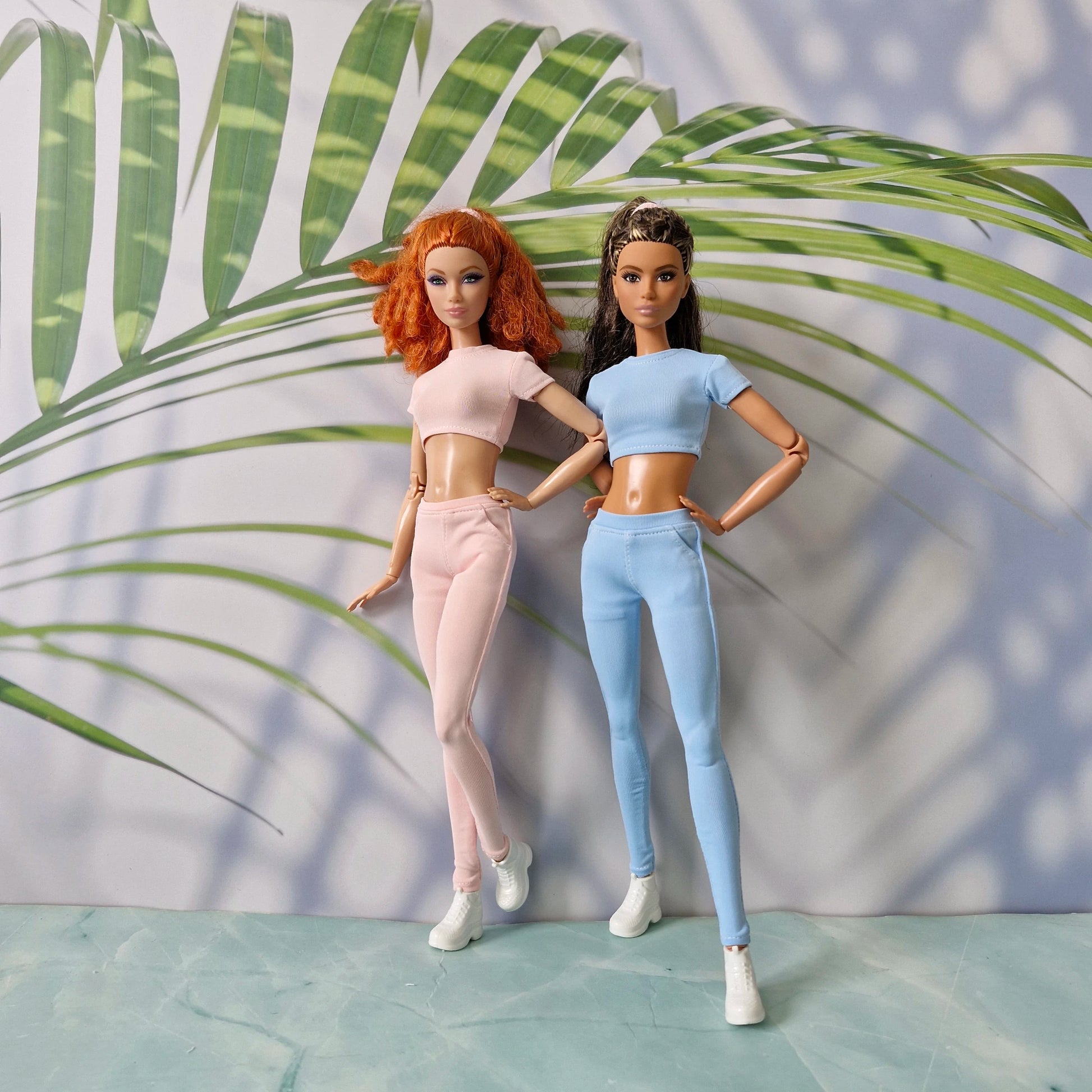 Standard doll in pink and Curvy doll in blue wearing mix and match ribbed separates for Barbie and for Curvy.