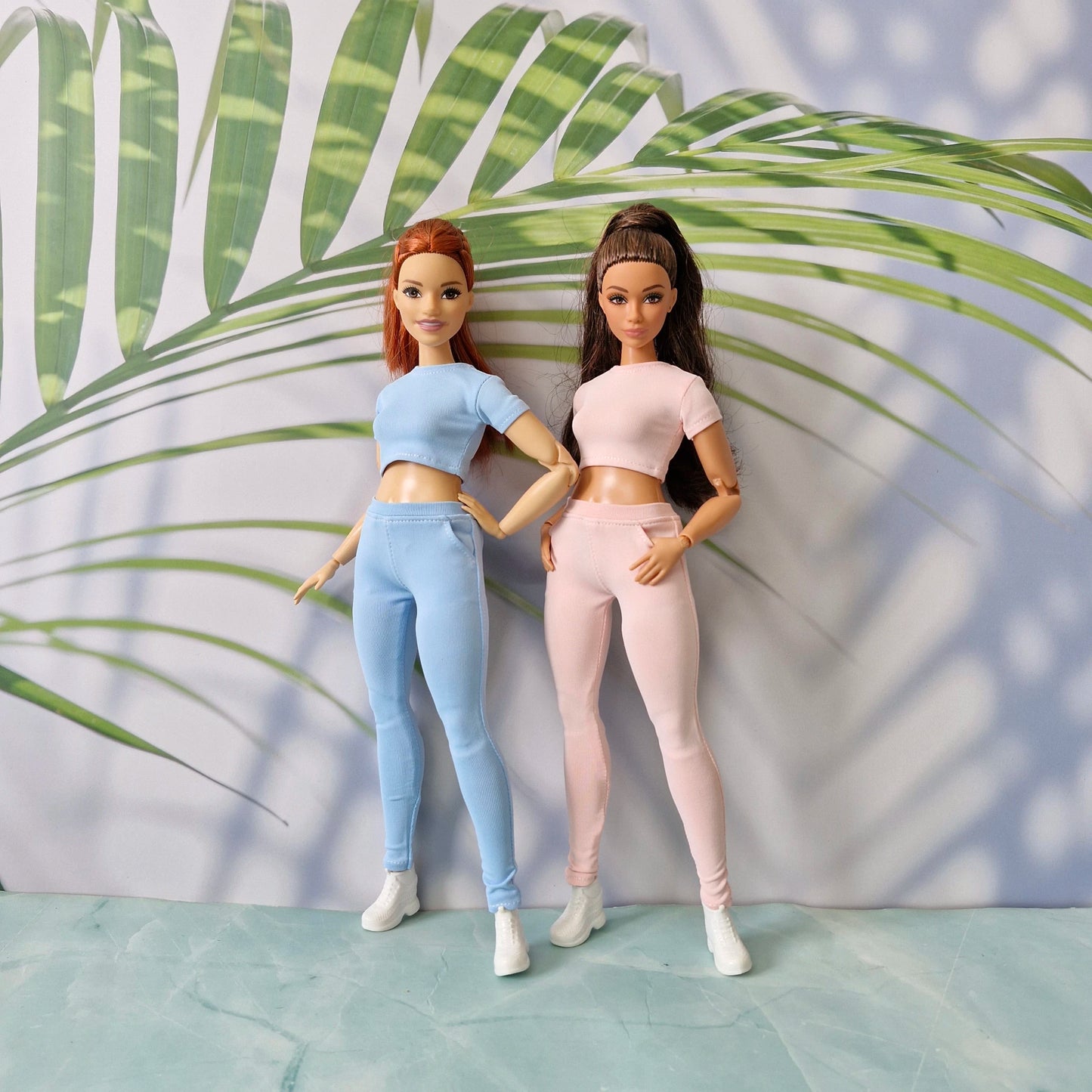 Fashion dolls modeling interchangeable ribbed tops and pants in blue and pink for Barbie and for Curvy.