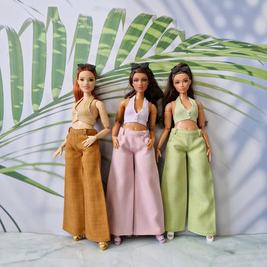 1/6 scale Curvy fashion dolls displaying a handmade summer clothing collection of tops and wide-leg pants.