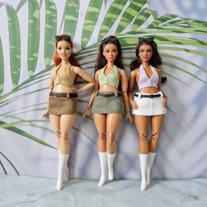 Three Curvy Barbie dolls showcasing a handmade mix-and-match summer clothing collection featuring ribbed halter tops and belted mini skirts.