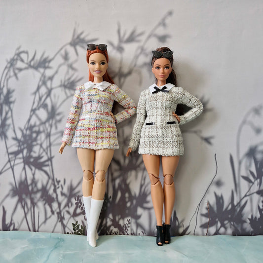 Curvy and standard Barbie dolls modeling handmade long-sleeve tweed dresses in colorful and black-and-white patterns.
