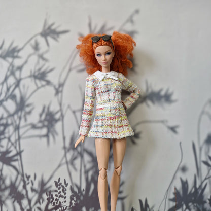 Standard redhead Barbie doll modeling a handmade multi-color tweed long-sleeve dress.