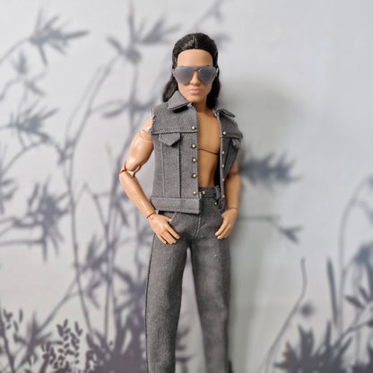 Ken doll posing shirtless in a stylish handmade grey denim vest and matching grey jeans.