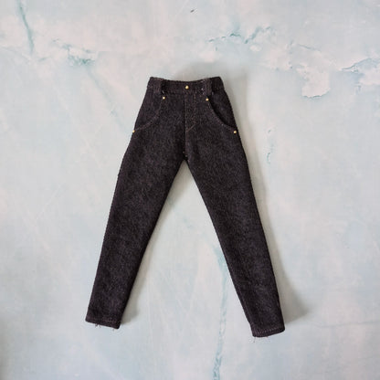 Flat lay of handmade 1/6 scale tailored dark wash denim jeans with front pockets for Ken dolls.