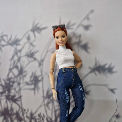 Redhead Curvy fashion doll posing in a custom 1/6 scale white top and dark blue ripped jeans.