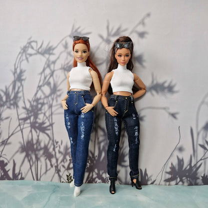 Two Curvy Barbie dolls standing together in handmade casual outfits featuring white tops and ripped jeans.