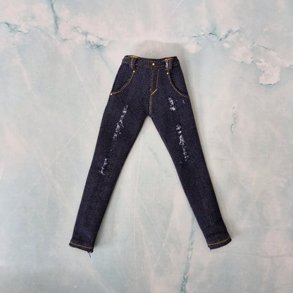 Flat lay of handmade 1/6 scale dark blue distressed denim jeans for Curvy Barbie.