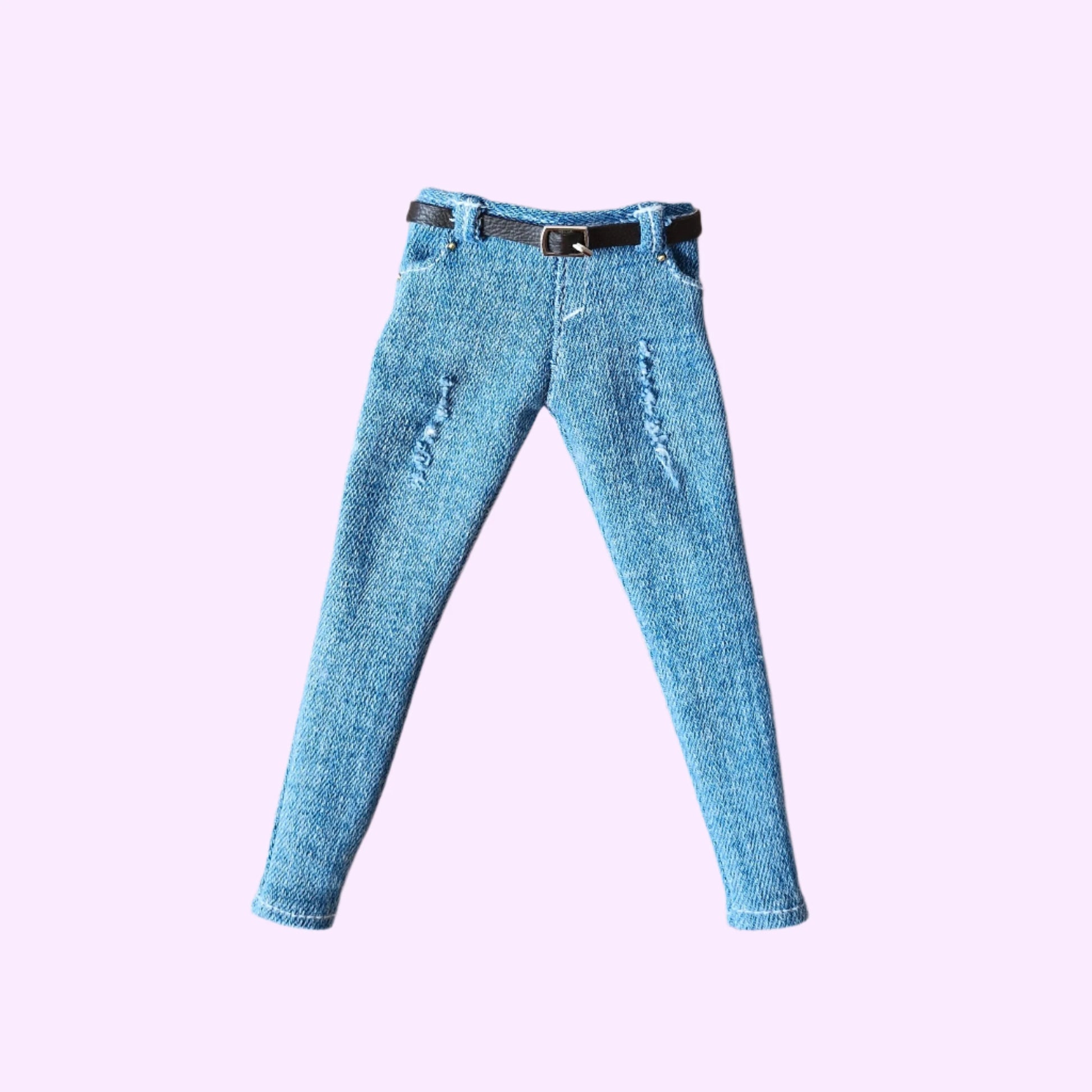 Curvy Barbie doll jeans: light blue distressed denim pants with belt, flat lay view.
