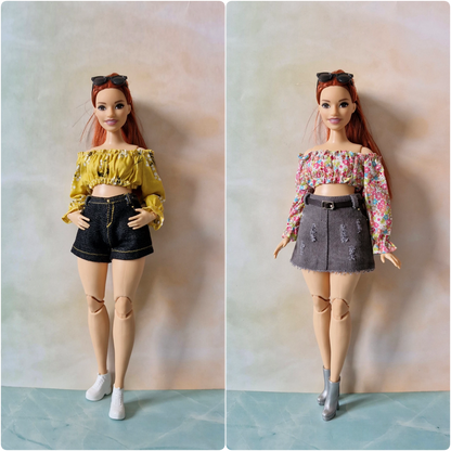 Two dolls wearing different outfits on a plain background