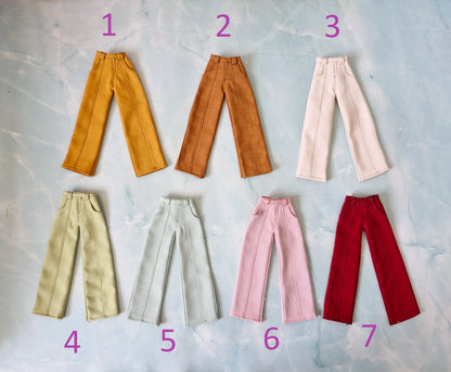 Flat lay of seven different colors of wide-leg Barbie doll pants numbered one through seven