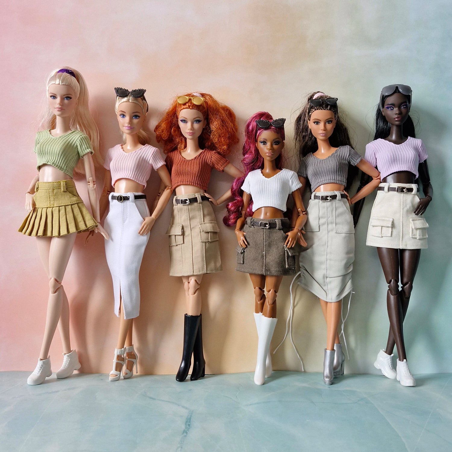 Collection of 6 diverse Barbie dolls wearing mix and match ribbed crop tops and trendy skirts
