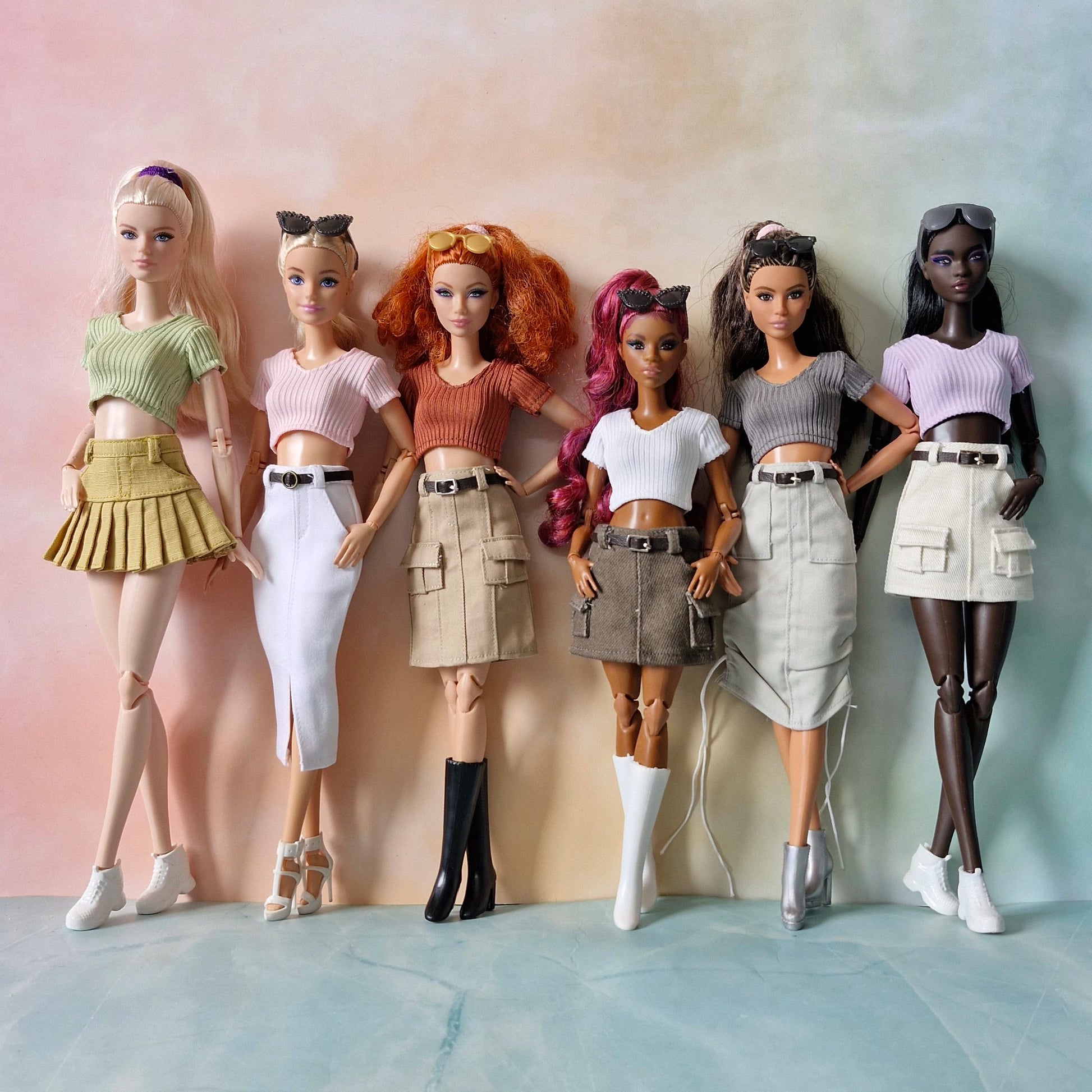 Collection of 6 diverse Barbie dolls wearing mix and match ribbed crop tops and trendy skirts