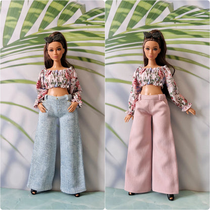 Side-by-side comparison of two Curvy Barbie dolls wearing the same floral crop top, one with light blue jeans and the other with pink wide-leg pants.